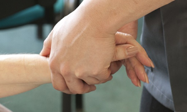 Osteopathy - working with client's hands. Copyright Jan Chlebik.